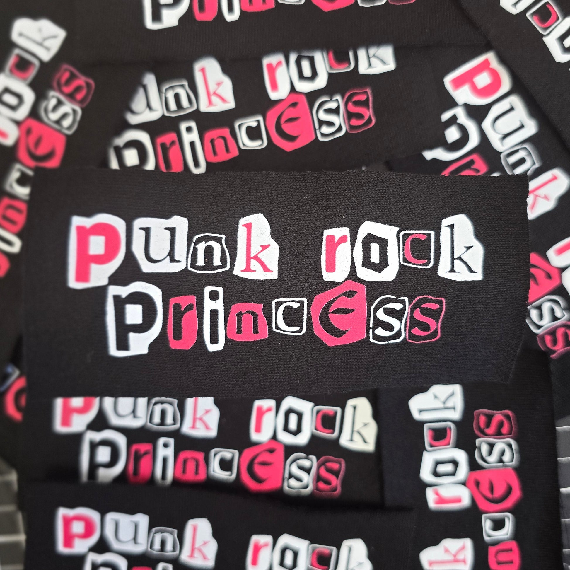 Black patch with 'Punk Rock Princess' text in white and pink on a black fabric background