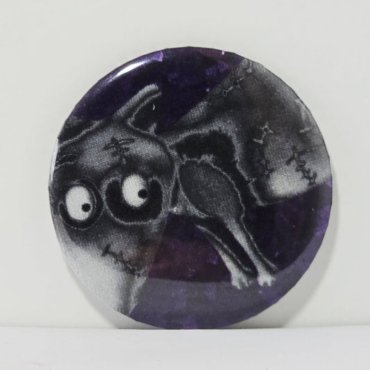 Circular badge with a black and white illustration of a dog on a purple background