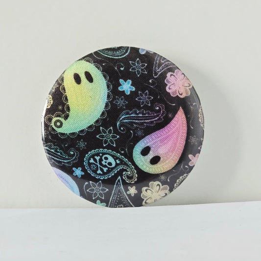 Circular product with ghost and paisley design on a white background