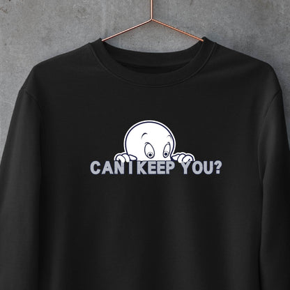 A black crewneck sweatshirt hanging on a wooden hanger against a textured gray wall. The sweatshirt features a white graphic of a cartoon ghost peeking over the text 'CAN'T KEEP YOU?' in white capital letters.