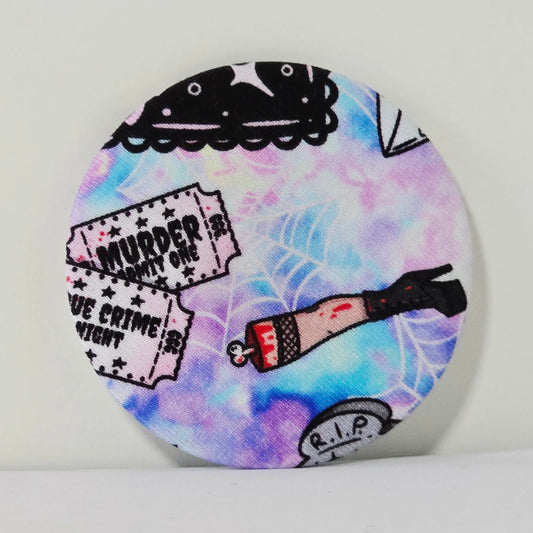 Circular product with tie-dye design and graphic elements on a white background